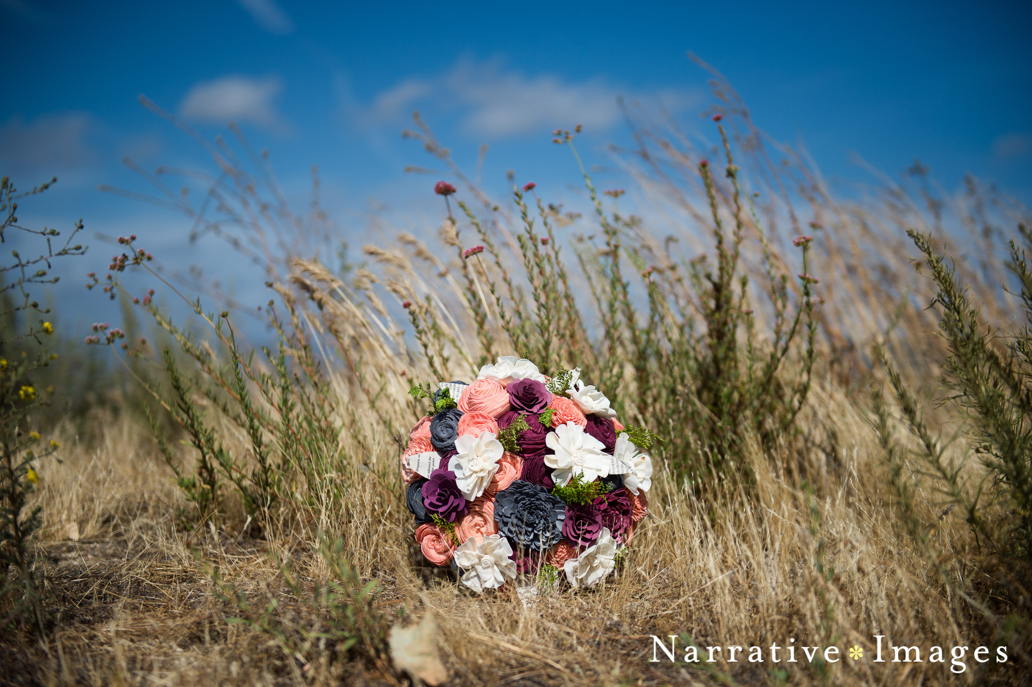 unique green eco flower brides bouquet in dry vineyard field with dried flowers