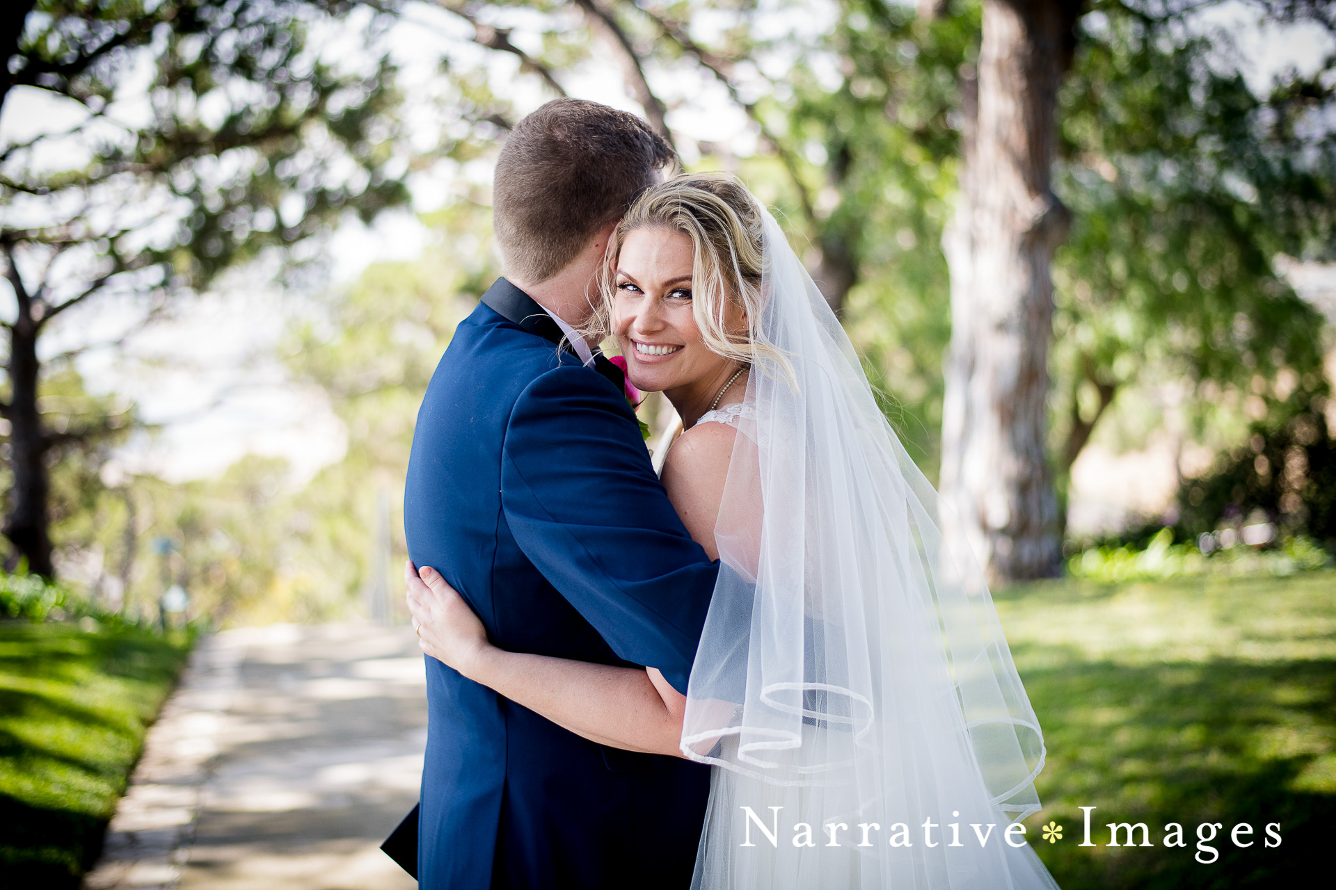 Bride embraces groom at Wayfairers Chapel in Rancho Palos Verdes