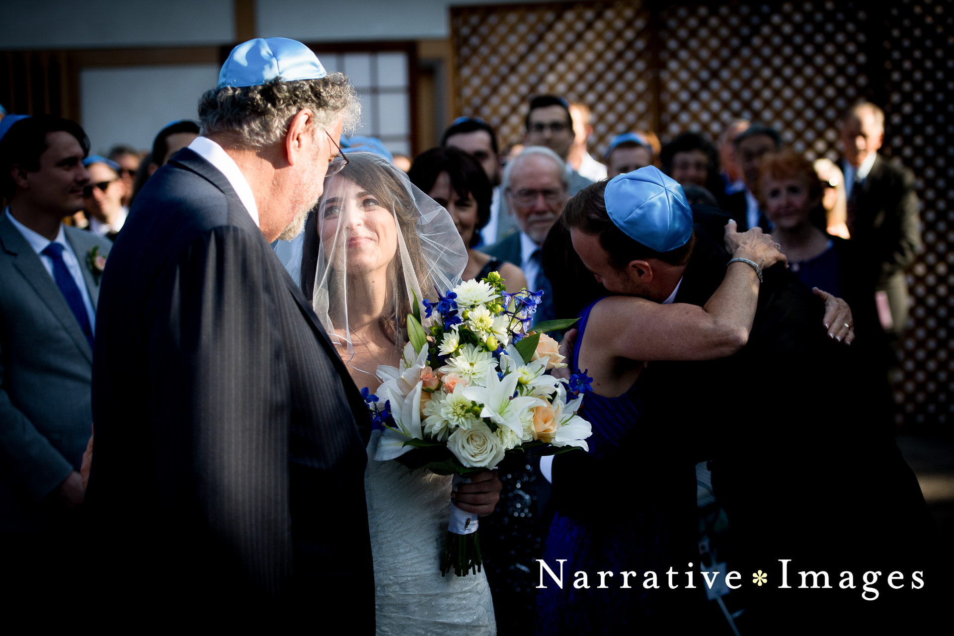 Bride is given away by her father during Jewish wedding ceremony at Japanese Friendship Gardens in Balboa Park