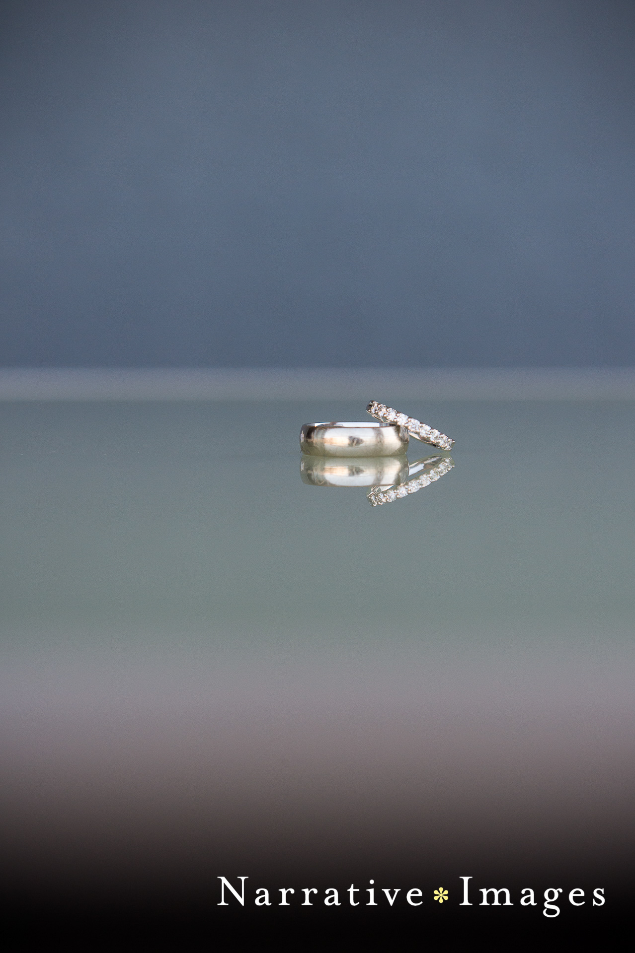 wedding rings reflected on surface