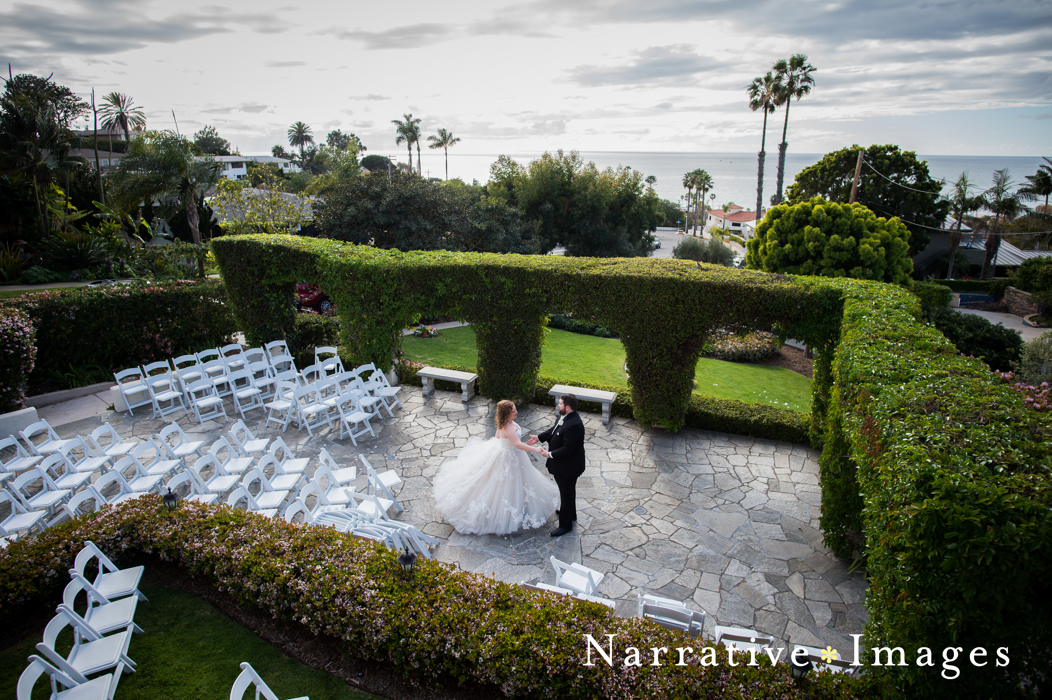 Bride and groom practice first dance in courtyard at the Thursday Club in Point Loma
