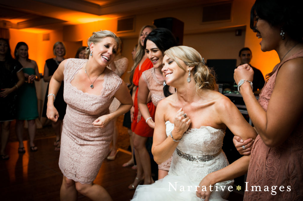 Bride and bridesmaids dance at reception at L'Auberge Del Mar
