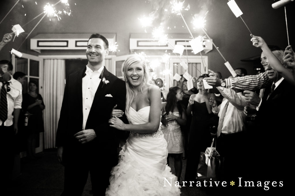 Bride and Groom exit reception under tunnel of sparklers at L'Auberge Del Mar