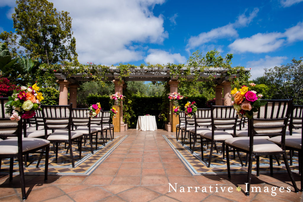Wedding ceremony setup with blue skies on the Sunset Terrace at Rancho Valencia Resort and Spa in Rancho Santa Fe