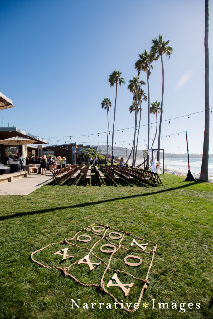 Tic tac toe setup for outdoor wedding reception at Scripps Seaside Forum in La Jolla, California
