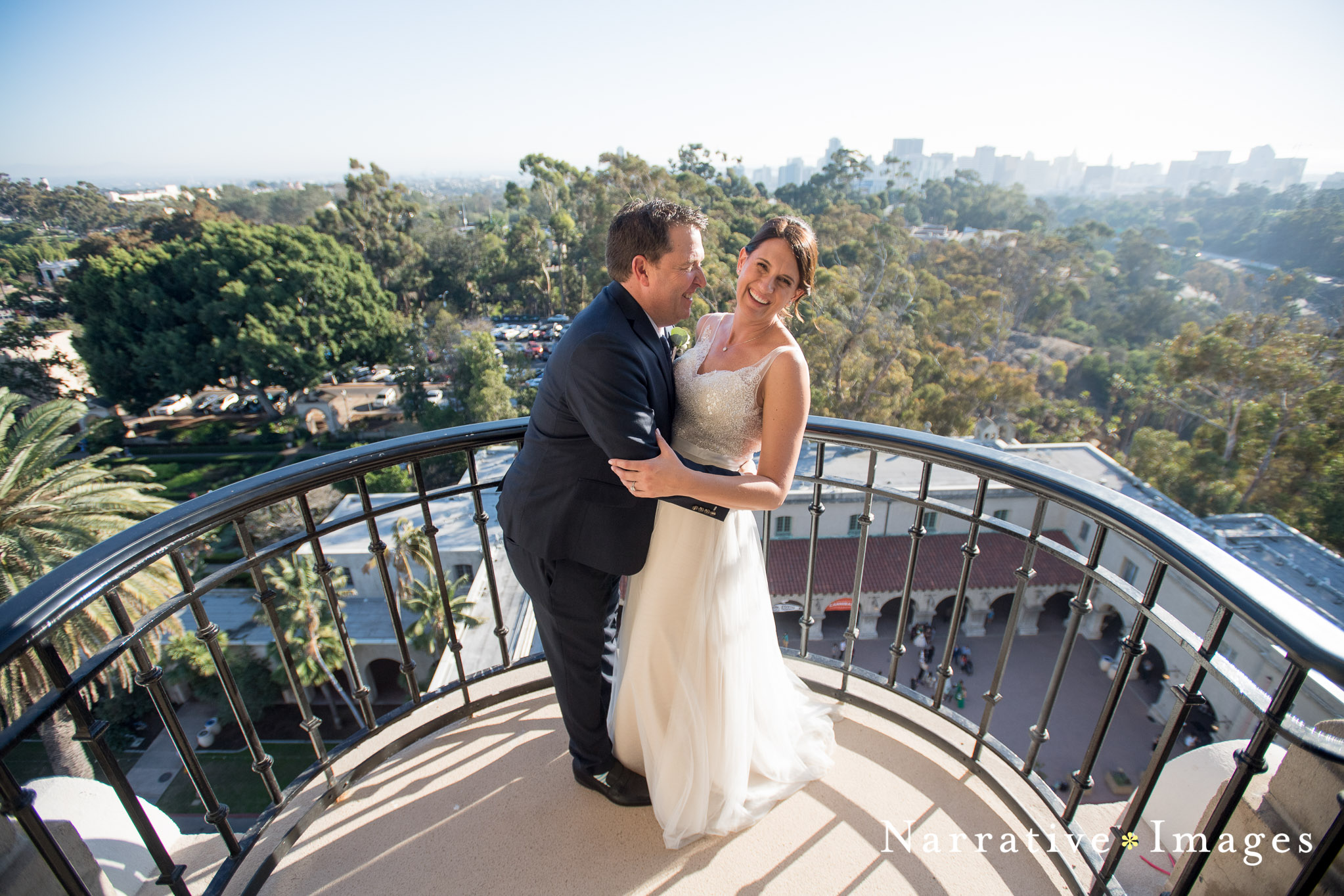 Bride and groom embrace in California Tower at Balboa Park San Diego