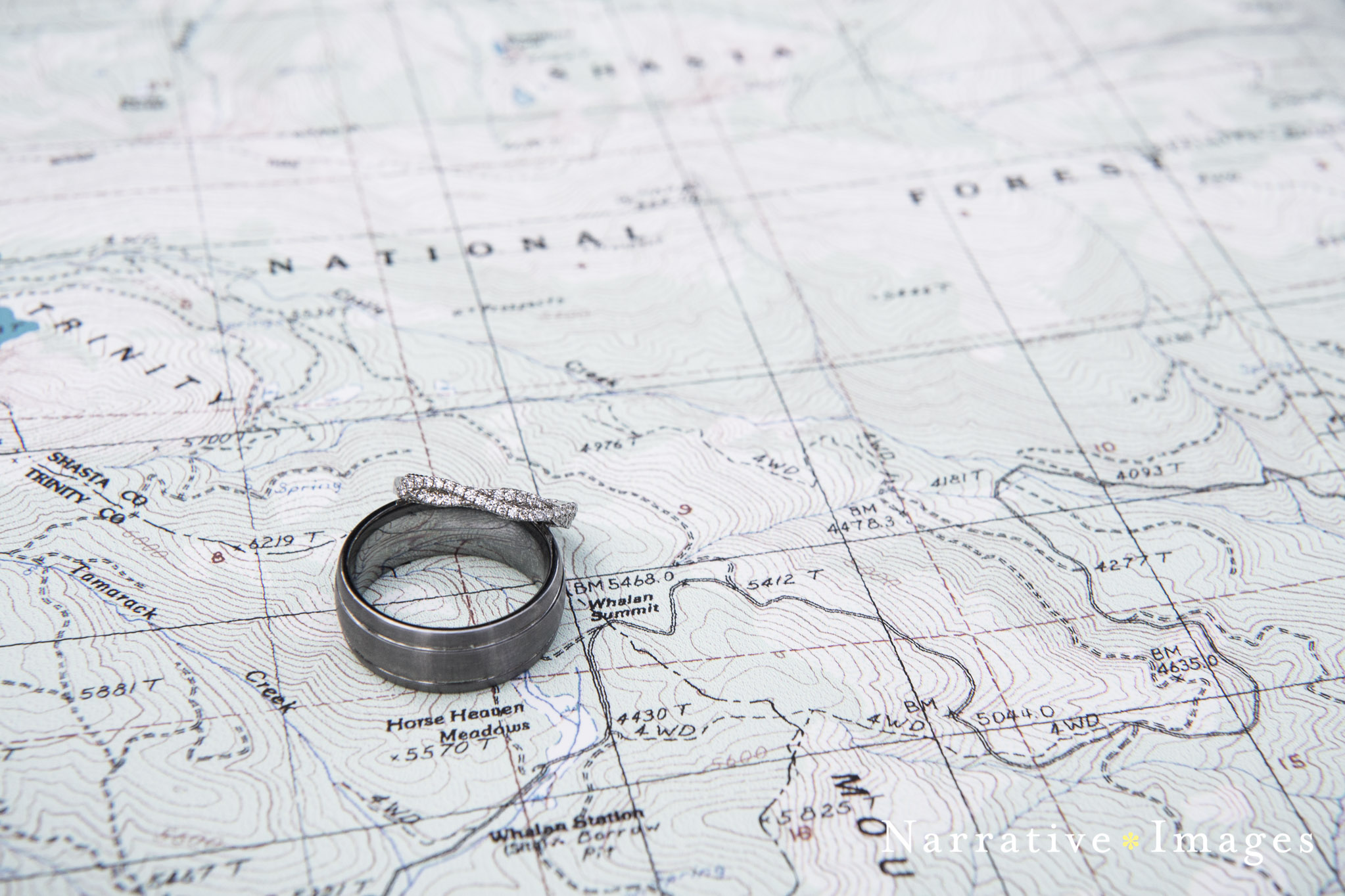 wedding rings on topographical map Mt shasta wedding