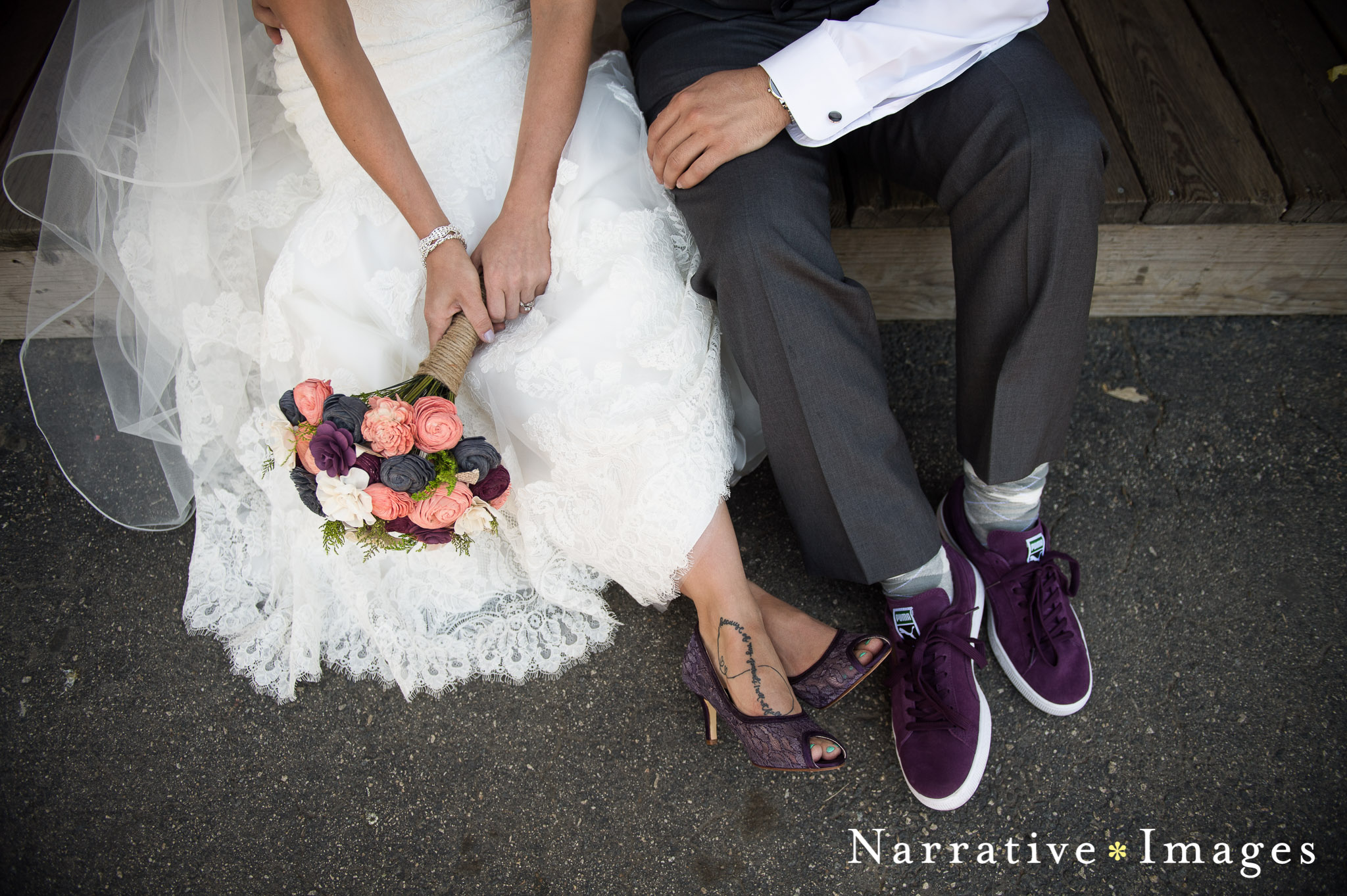 the feet of the bride and groom sitting on street for downtown Temecula wedding