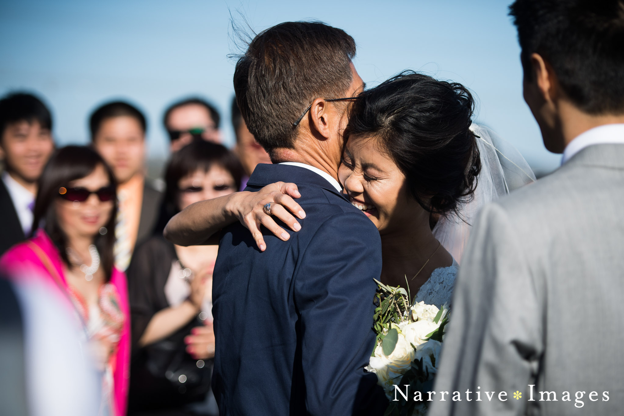 father gives away bride as she embraces him emotional candid photojournalistic wedding photo