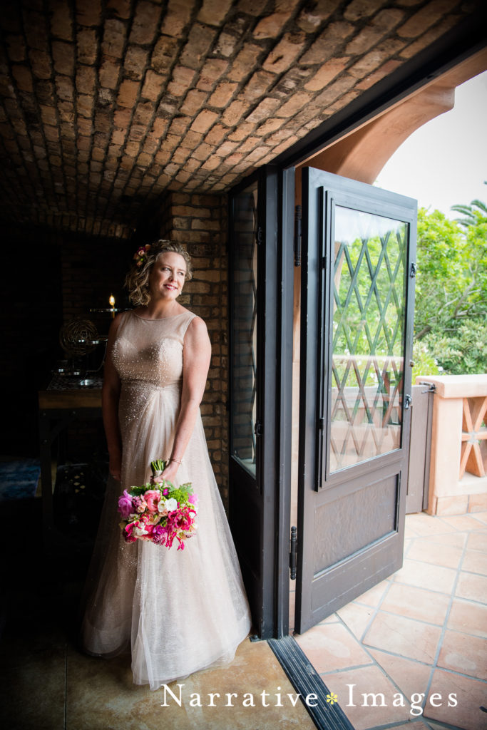Bride standing in doorway at Rancho Valencia Resort and Spa in Rancho Santa Fe