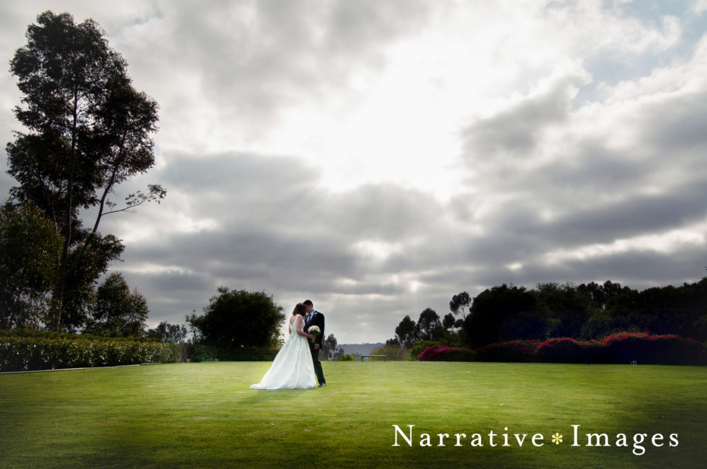 Bride and groom kiss on Croquet Lawn at Rancho Valencia Resort and Spa in Rancho Santa Fe