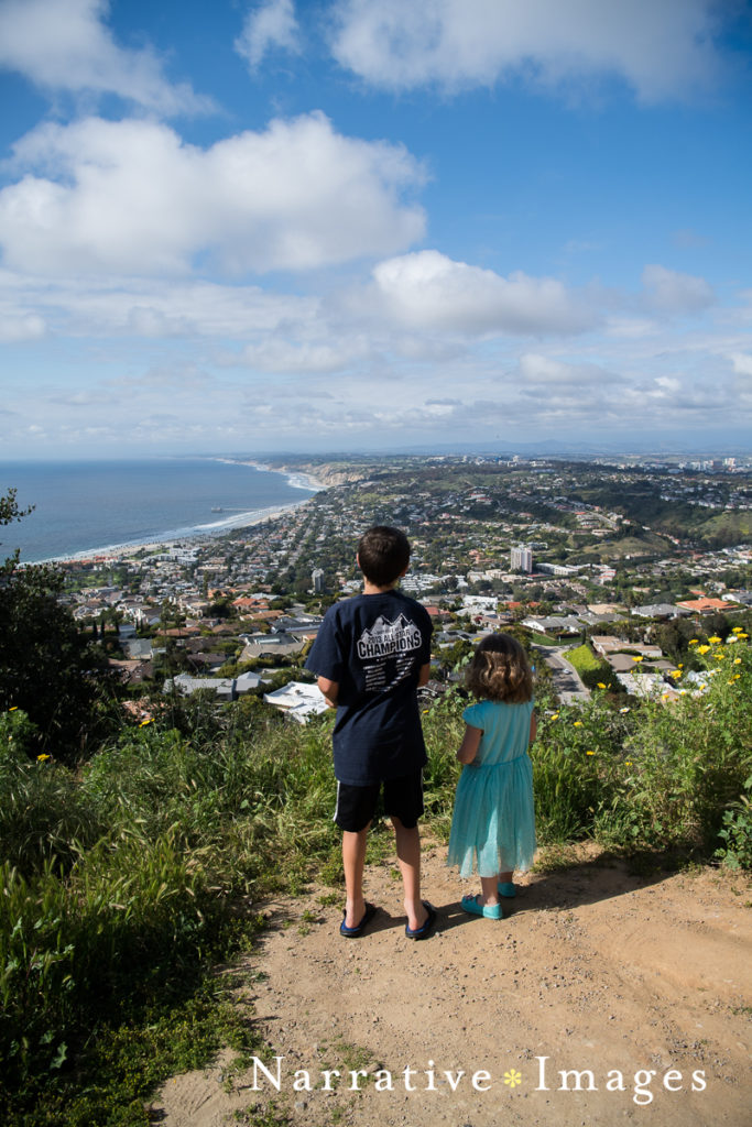 During COVID quarantine, kids explore a view of the Pacific Ocean